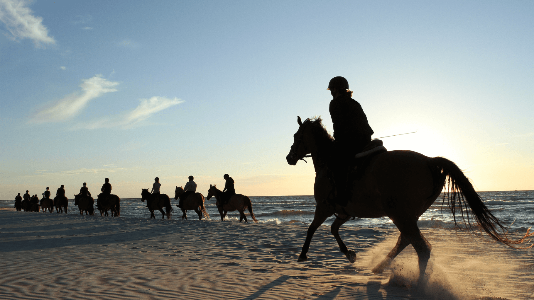 Horse riding in Cornwall - 5 brilliant beach rides you need to try * Horse-riding-in-Cornwall_riders-in-the-surf