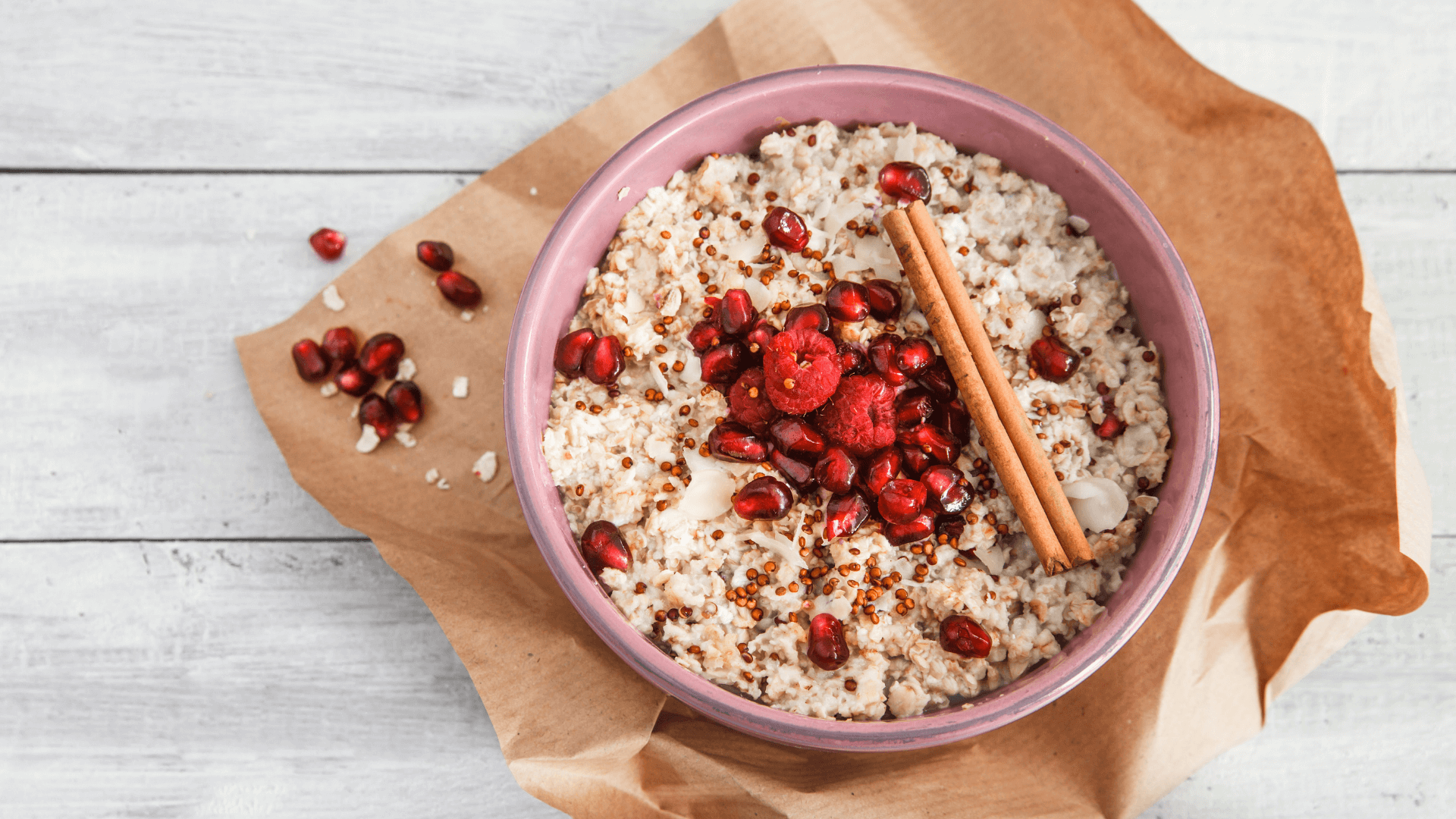 7 Creative Oat Recipes for Breakfast to Level Up Your Day * oat-recipes-for-breakfast - porridge with raspberries, cinnamon stick and pomegranate seeds
