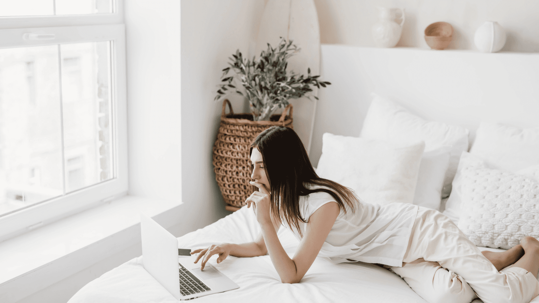 4 Smart Ways to Support Your Career Advancement Goals * career-advancement-goals-woman-lying-on-bed-with-macbook