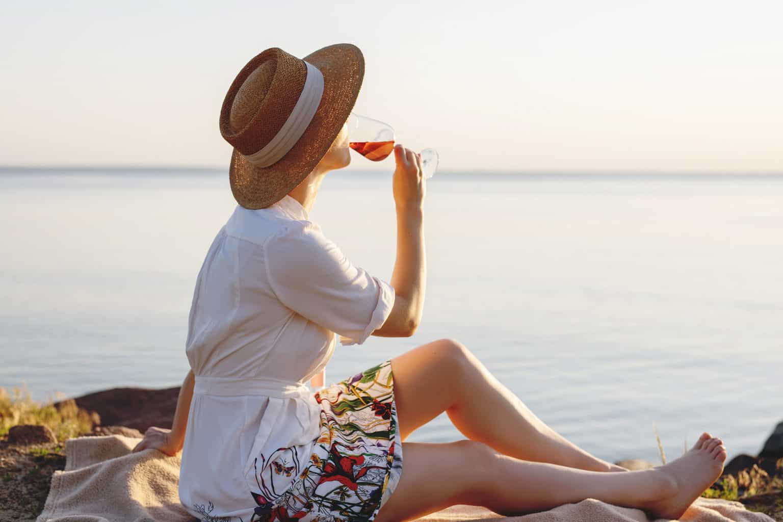 How to Get an Authentic Taste of Spain - 15 Easy Spanish Food Recipes * easy-spanish-food-recipes-girl-drinking-wine-at-beach
