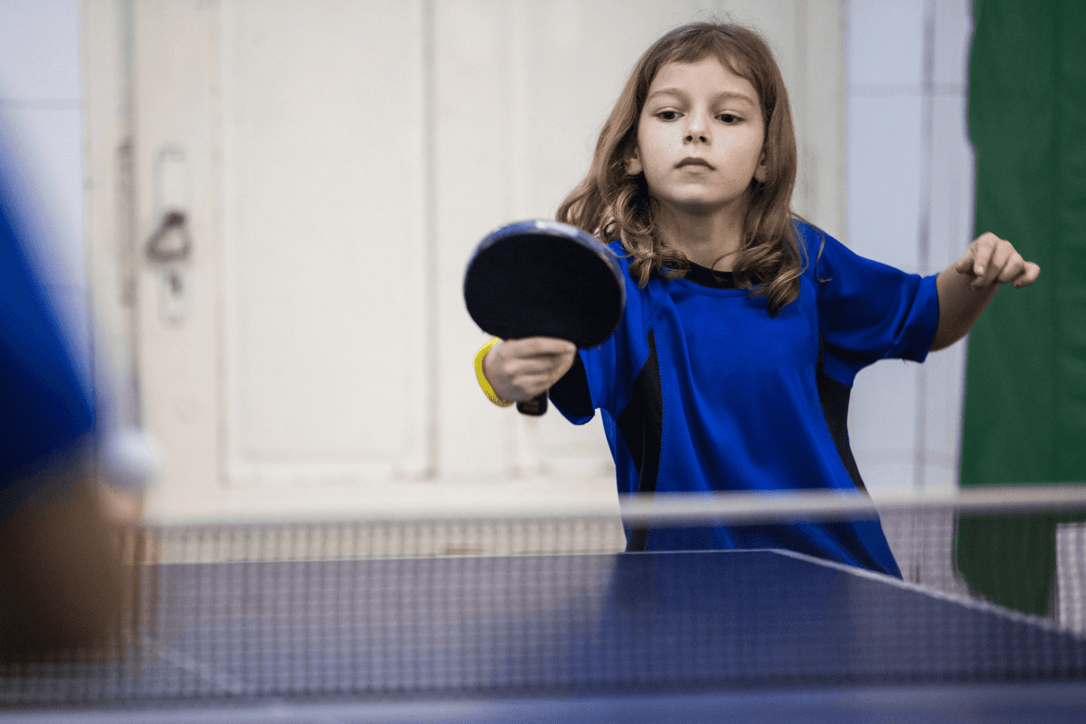 7 Benefits of a Game Room at Home for Stay-At-Home-Moms * game-room-at-home-girl-playing-table-tennis-ping-pong