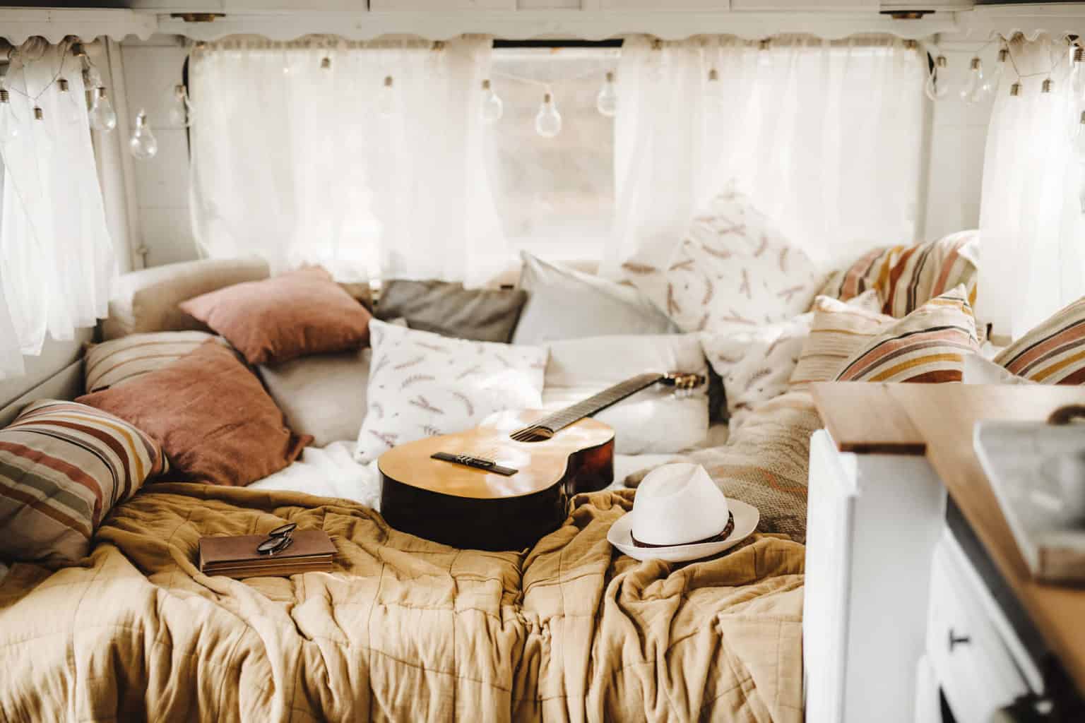 45 Best Essentials For Your Road Trip Checklist * road-trip-checklist-guitar-hat-bed