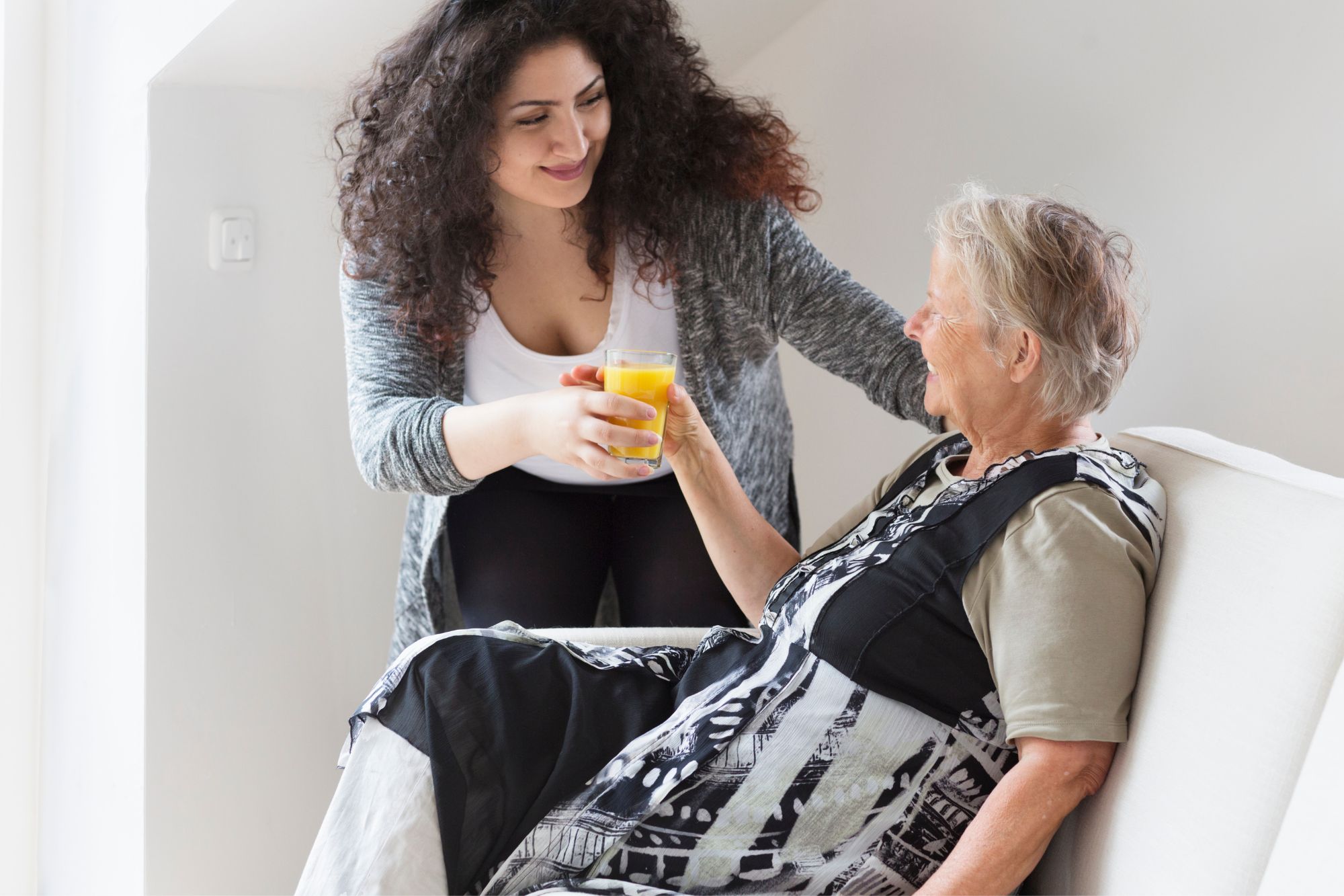 What Is Home Health Care and Who Qualifies For It? * home-health-care-carer-and-seated-lady-pinterest