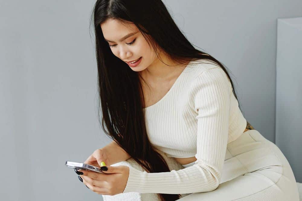 Tips and Tricks to Straighten Your Hair Safely: A Guide to Effortless Style * straighten-your-hair-safely-phone