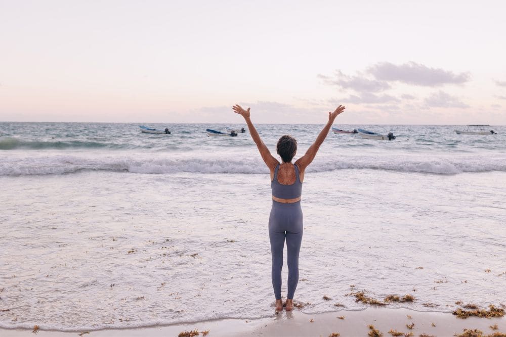20 New Year Rituals of Renewal to Help You Rediscover Yourself * new-year-rituals-of-renewal-yoga-beach
