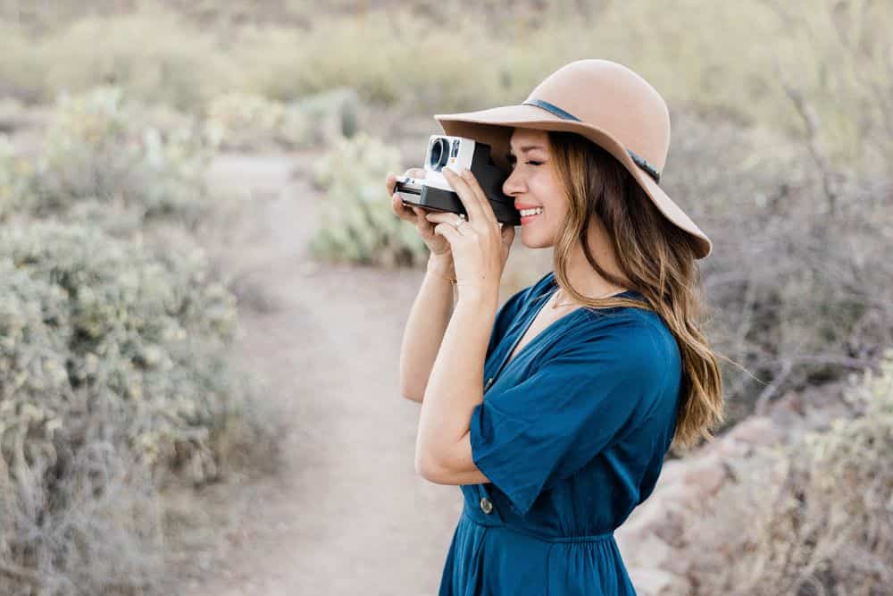 Why Rompers Are Your Summer Travel Wardrobe's Best Kept Secret * rompers-summer-travel-wardrobe-girl-photographing